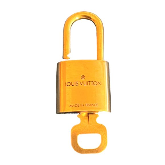 Louis Vuitton Accessories - Small Brass Louis Vuitton Lock and Key Set.